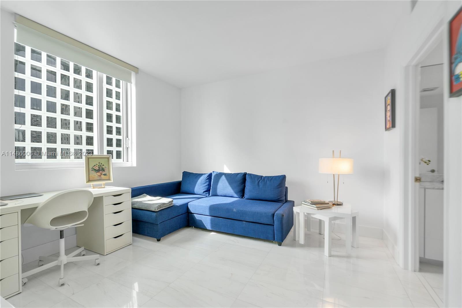 500 Brickell Avenue, Unit 2602 Miami, FL 33131 - Photo 21 of 38 a living room with furniture and a window
