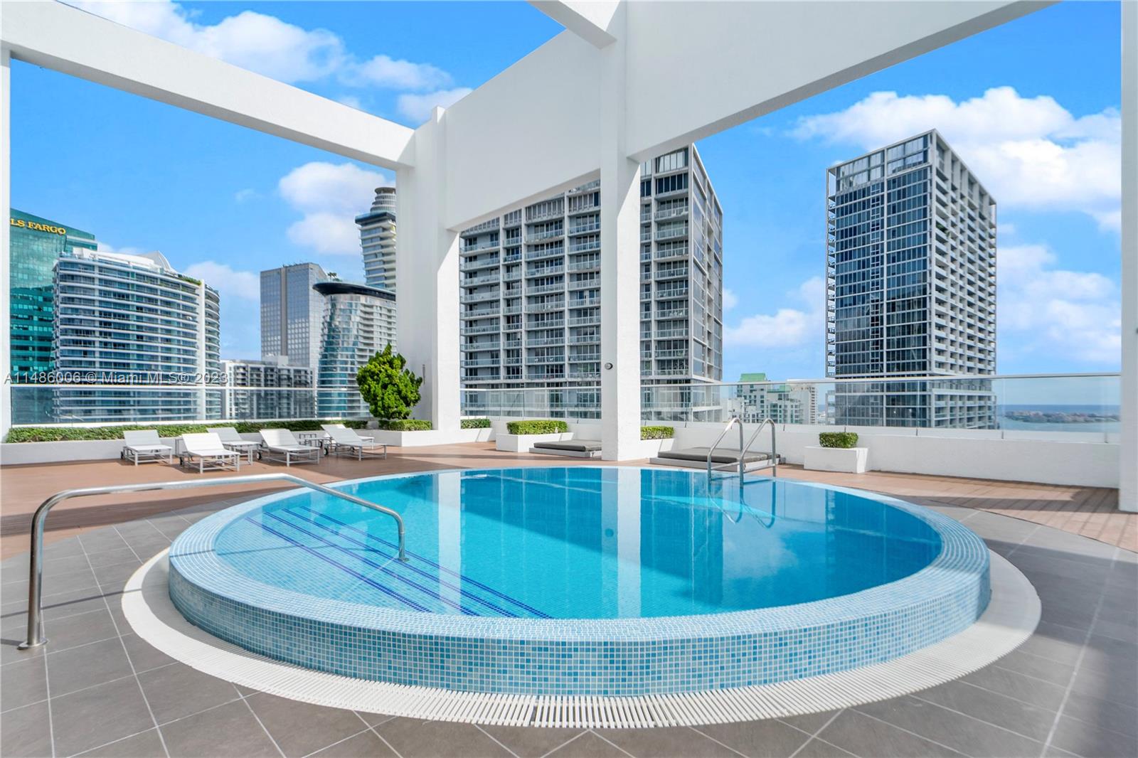 500 Brickell Avenue, Unit 2602 Miami, FL 33131 - Photo 26 of 38 a large pool with tall buildings