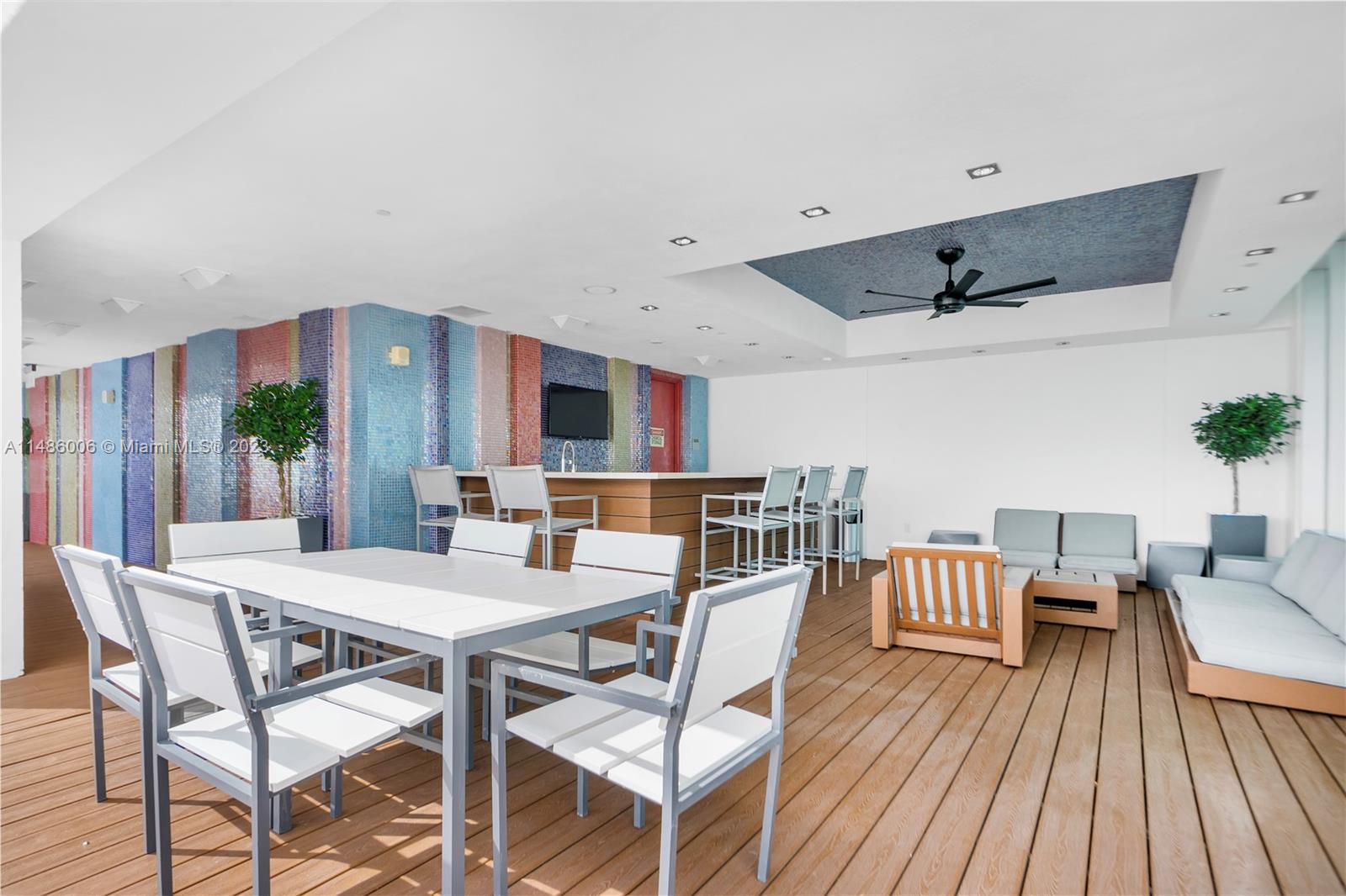 500 Brickell Avenue, Unit 2602 Miami, FL 33131 - Photo 27 of 38 a view of a dining room with furniture window and wooden floor