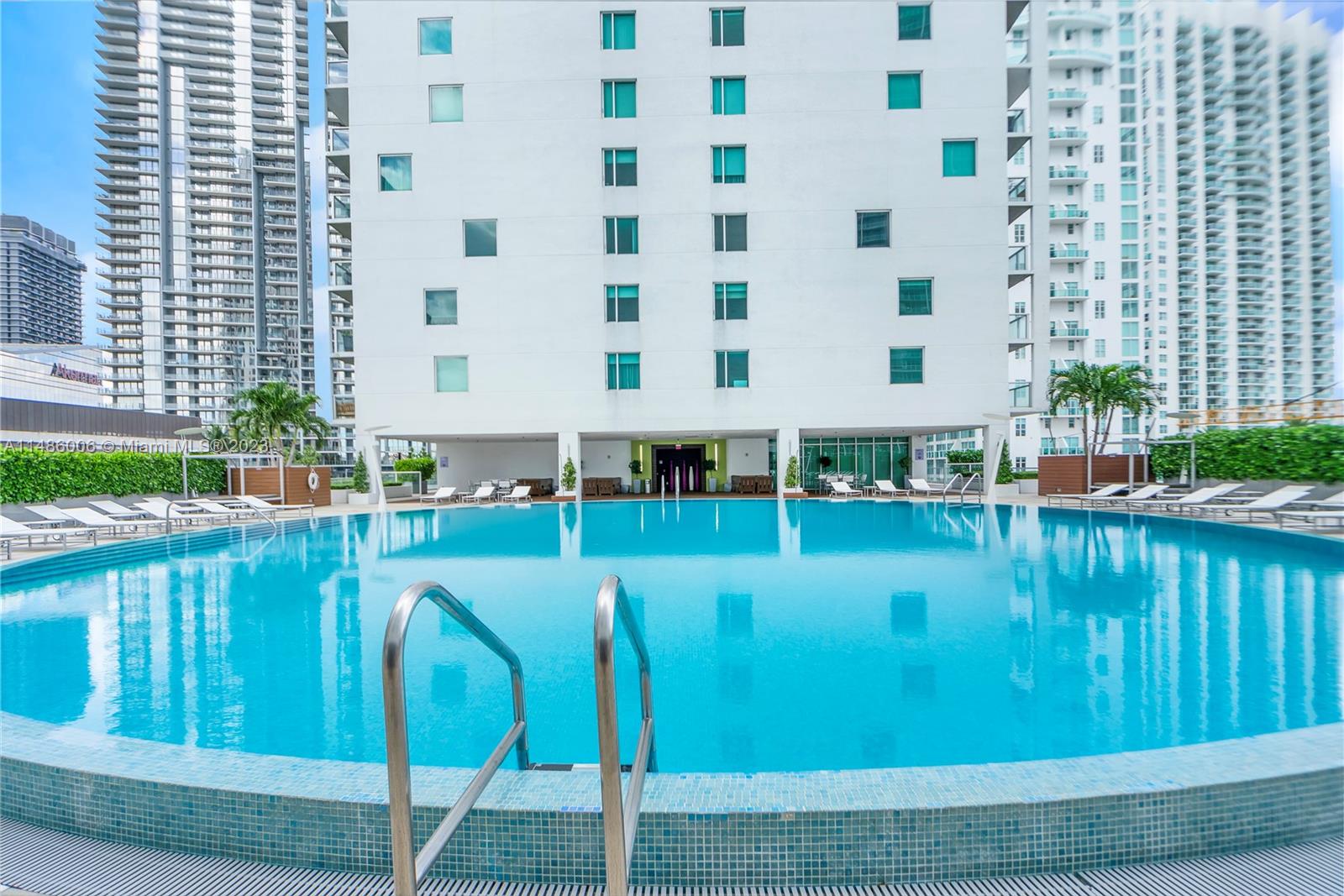 500 Brickell Avenue, Unit 2602 Miami, FL 33131 - Photo 30 of 38 a view of swimming pool with outdoor seating and plants