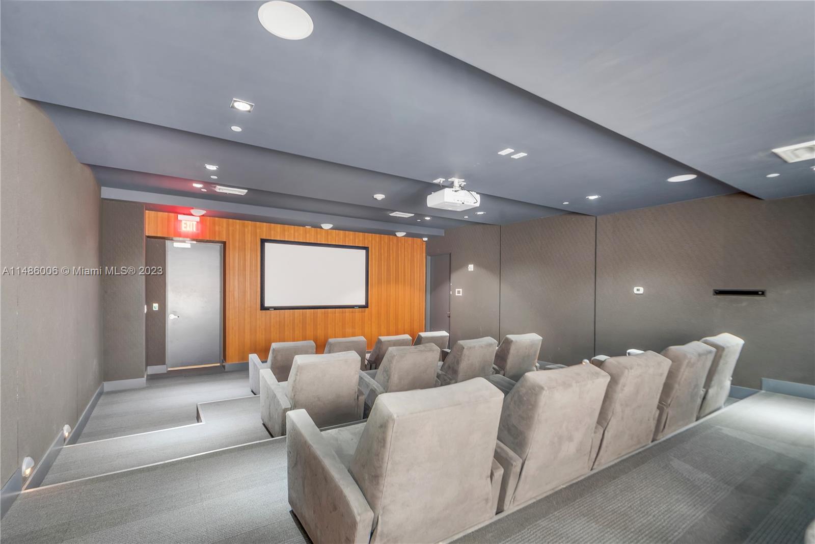 500 Brickell Avenue, Unit 2602 Miami, FL 33131 - Photo 31 of 38 a lobby with furniture and a projector screen