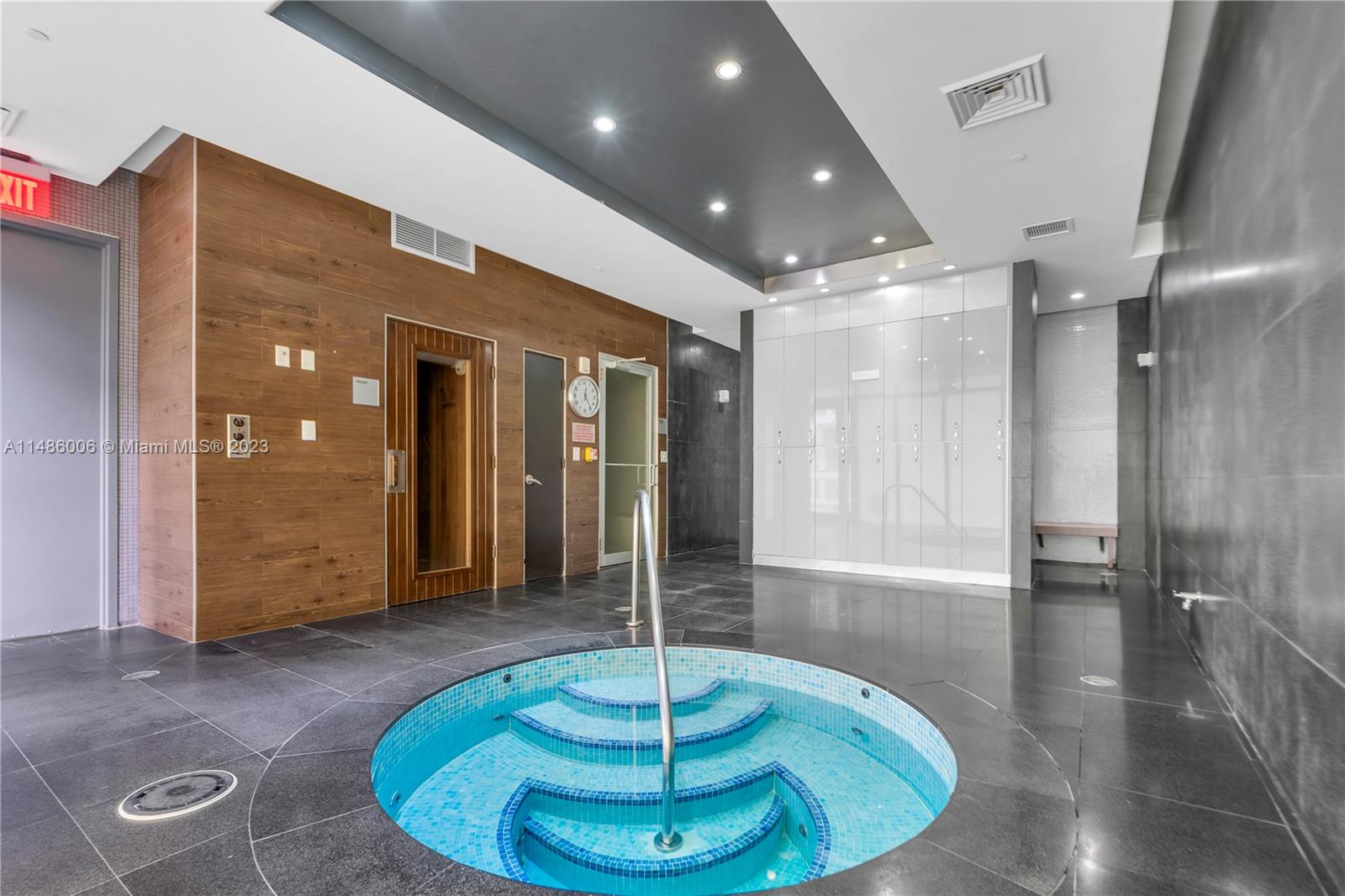 500 Brickell Avenue, Unit 2602 Miami, FL 33131 - Photo 32 of 38 a room with filled with a chandelier and glass door