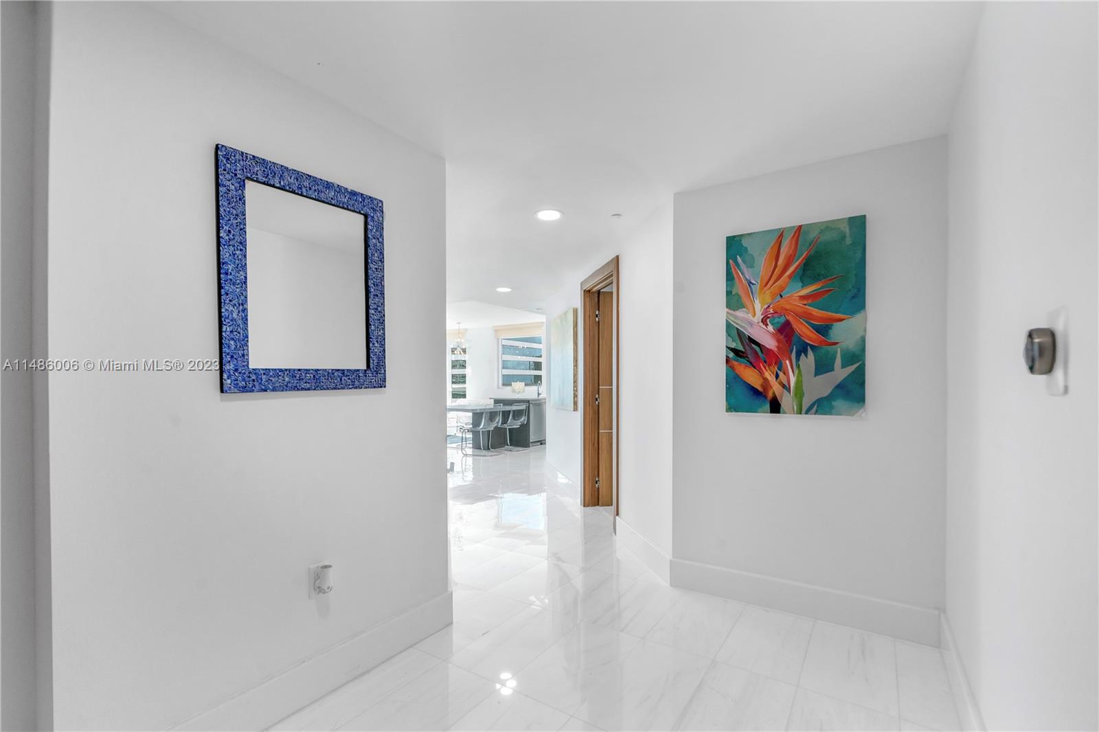 500 Brickell Avenue, Unit 2602 Miami, FL 33131 - Photo 5 of 38 a view of a hallway with painting on the wall