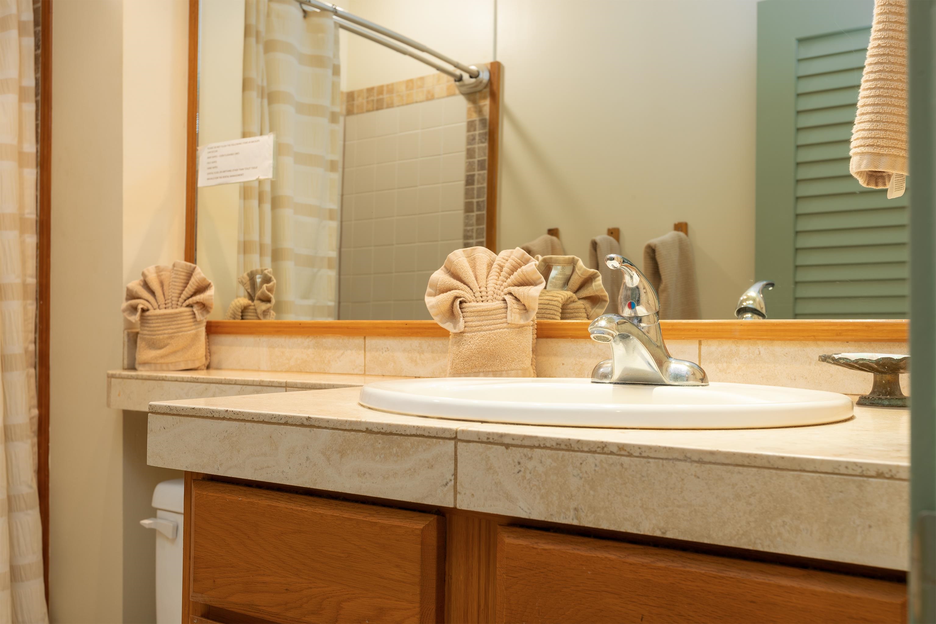 800 South Kihei Road, Unit 302 Kihei, HI 96753 - Photo 12 of 50 a bathroom with a sink and a mirror