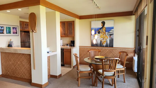 a view of a dining room with furniture large windows and wooden floor