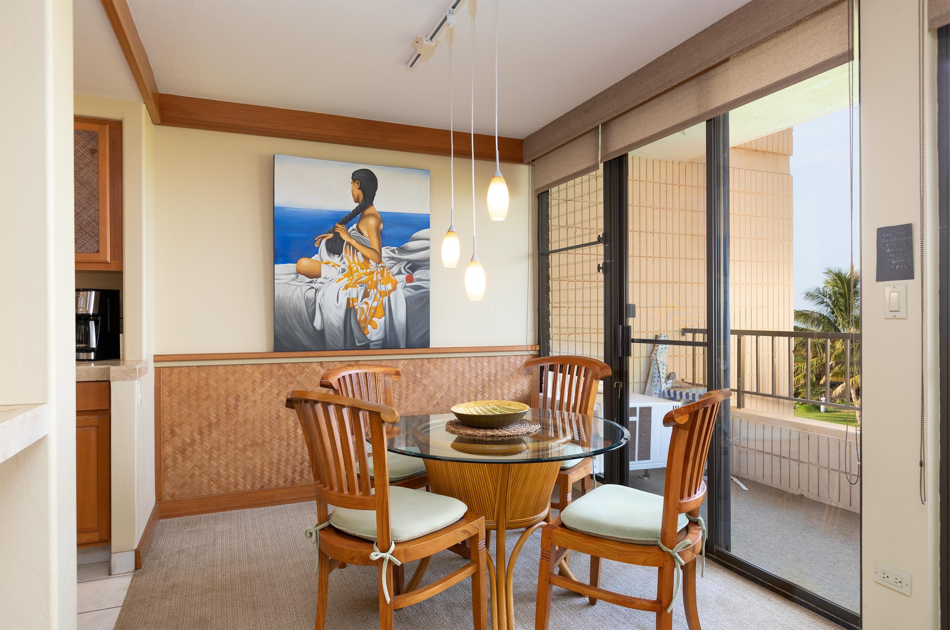 800 South Kihei Road, Unit 302 Kihei, HI 96753 - Photo 4 of 50 a view of a dining room with furniture large windows and wooden floor