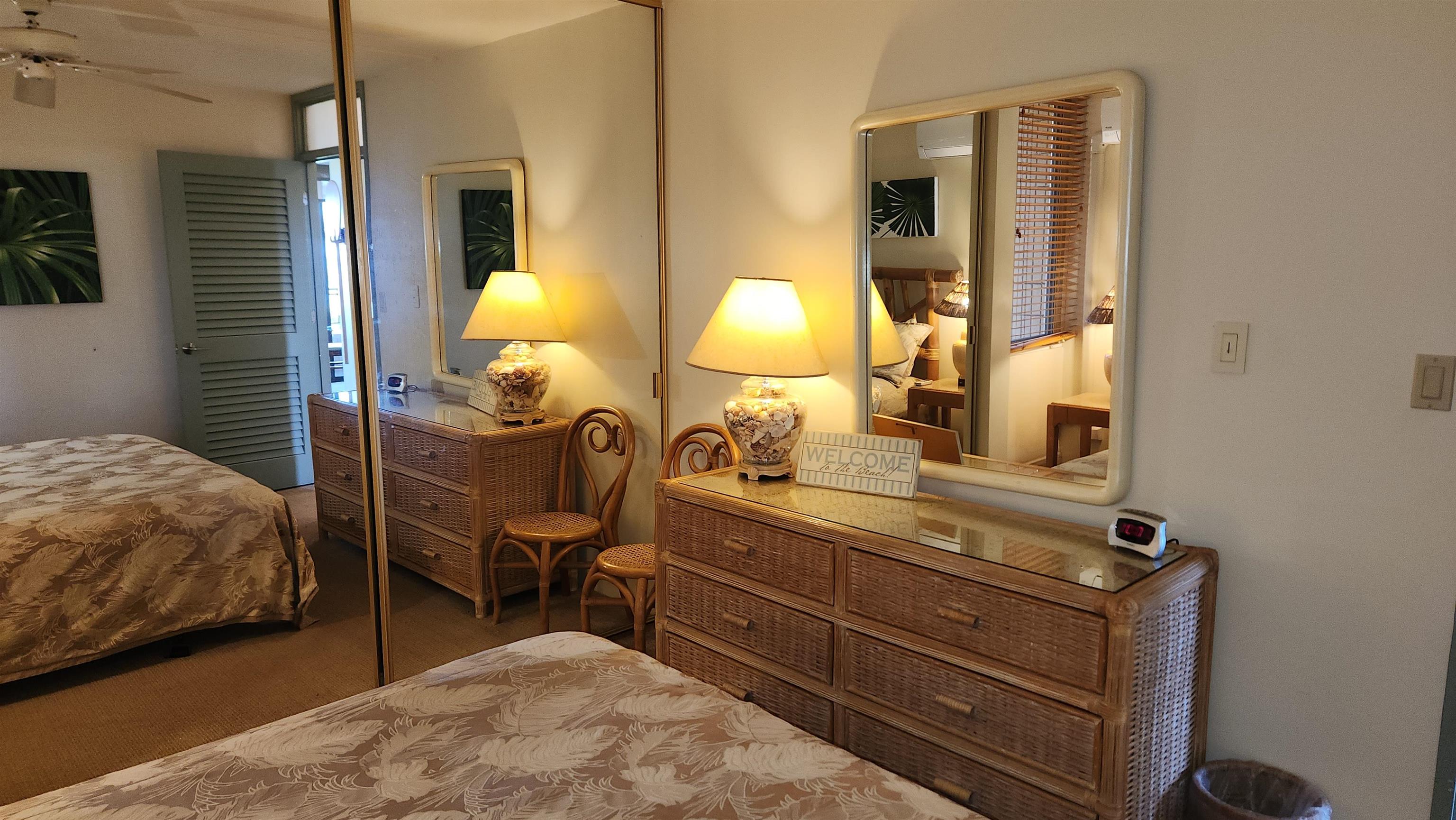 800 South Kihei Road, Unit 302 Kihei, HI 96753 - Photo 49 of 50 a bedroom with a bed and lamp on dresser