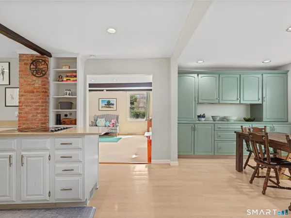 a kitchen with cabinets and window