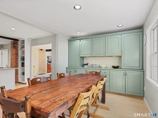 a kitchen with a table and chairs in it