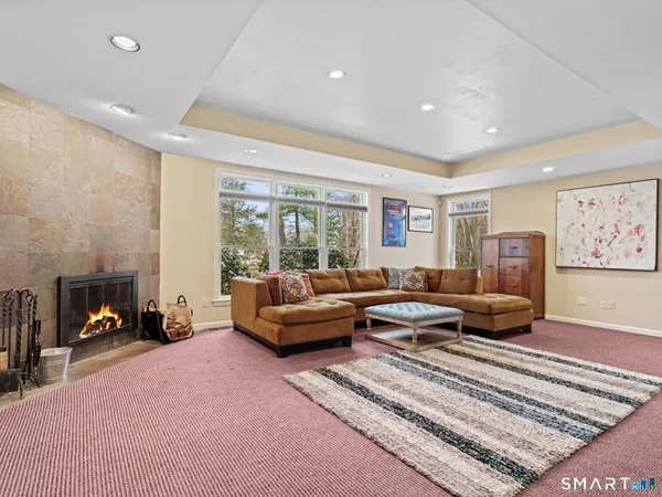 a living room with furniture and a fireplace