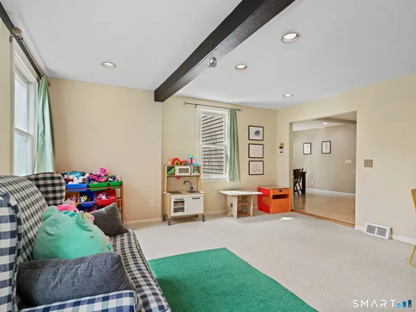 a living room with furniture and a table