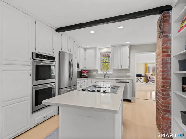 a kitchen with a refrigerator stove and microwave