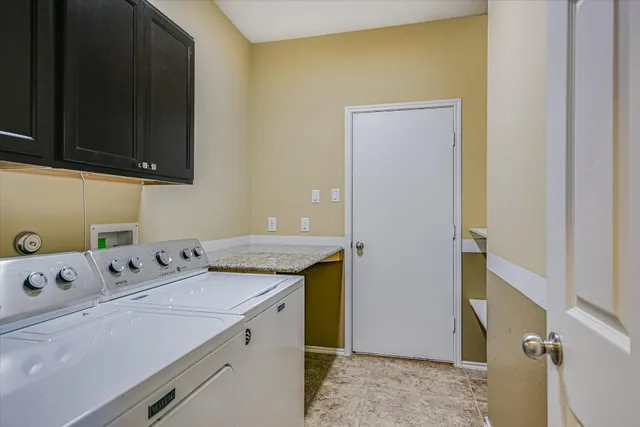 a utility room with washer and dryer
