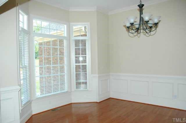 613 Competition Raleigh, NC 27603 - Photo 2 of 10 Beautful formal dining room just off the grand foyer entry with 11' ceilings, nice wide moldings and wainscoting with bay window and butler's pantry just a step away! Other