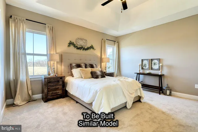 a bedroom with a bed a dresser and a window