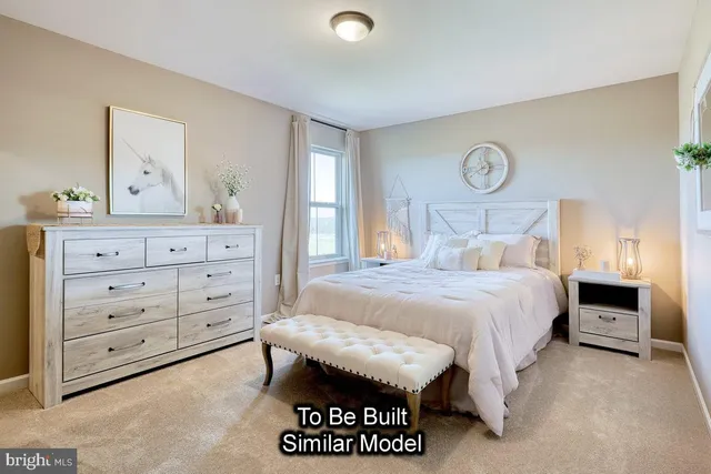 a bedroom with a bed and a table in it