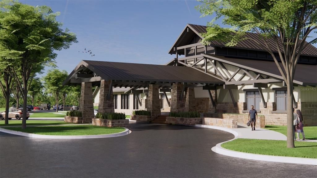 10726 Rabbit Grove Trail Palmetto, FL 34221 - Photo 20 of 28 a front view of a building with a garden