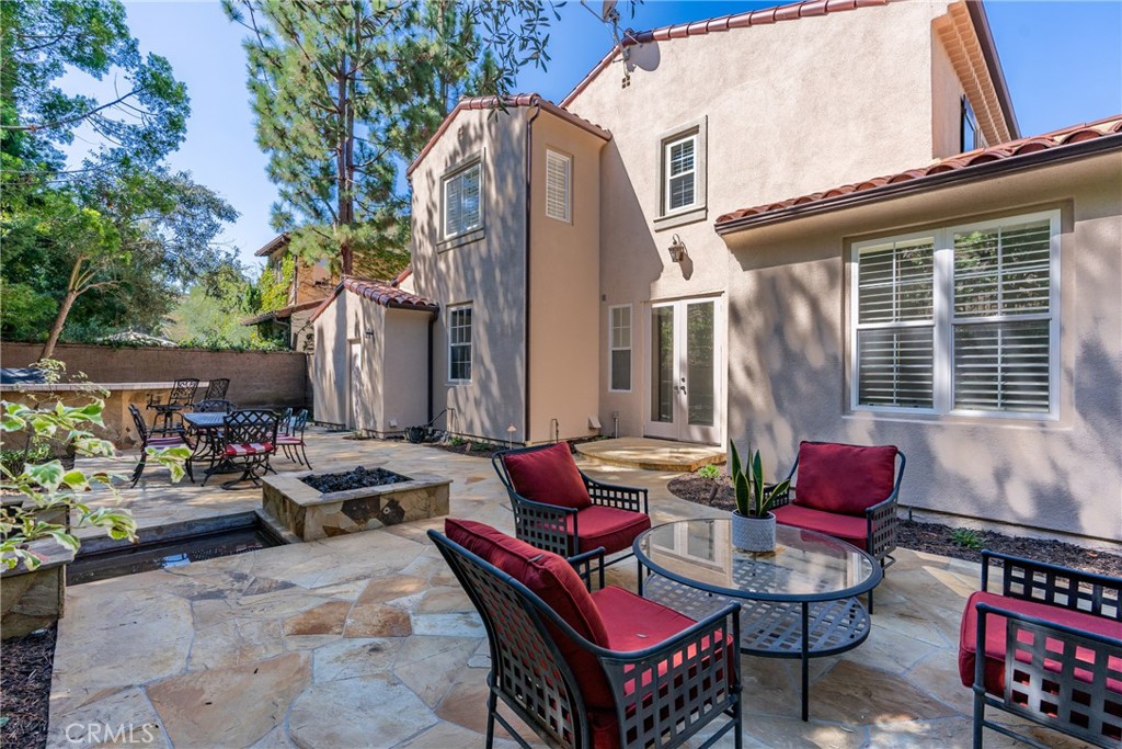 74 Clouds Irvine, CA 92603 - Photo 17 of 27 a backyard of a house with outdoor seating