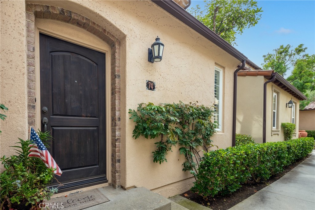 74 Clouds Irvine, CA 92603 - Photo 2 of 27 a front view of a house with a garage
