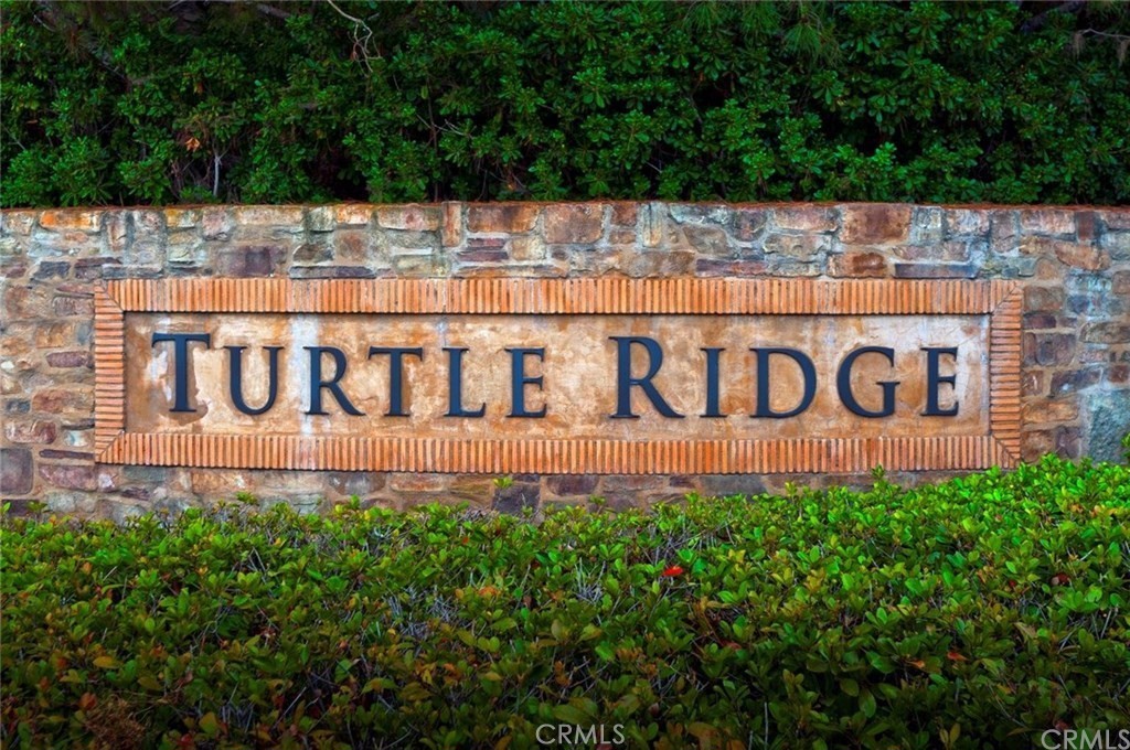 74 Clouds Irvine, CA 92603 - Photo 27 of 27 a view of sign board with yard and buildings in the background