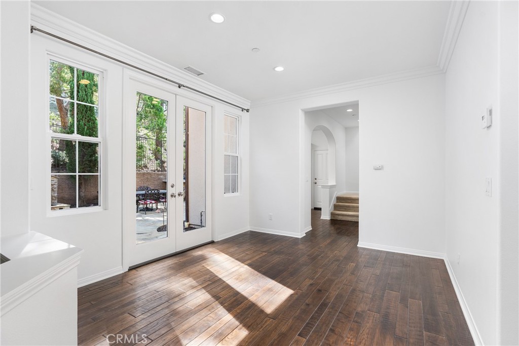 74 Clouds Irvine, CA 92603 - Photo 3 of 27 an empty room with large window and wooden floor