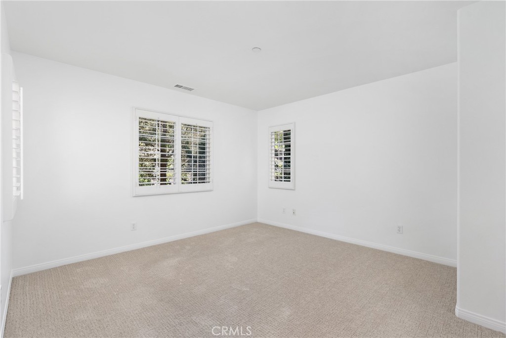 74 Clouds Irvine, CA 92603 - Photo 10 of 27 an empty room with windows