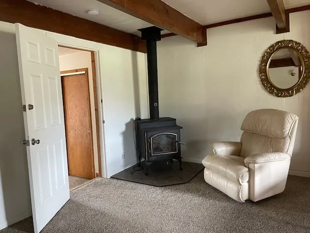 a bathroom with a toilet a sink and a window