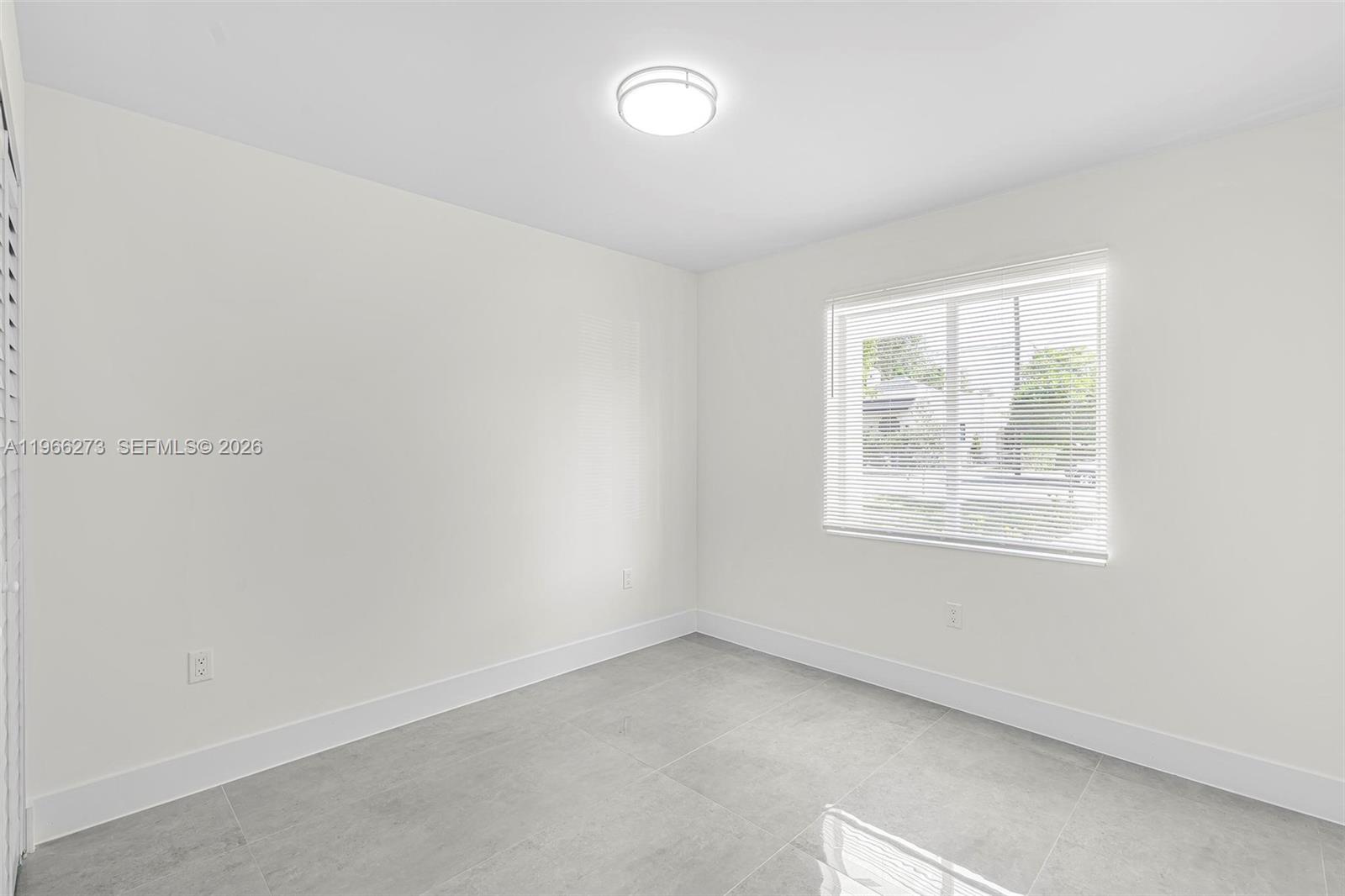 933 Northwest 50th Street Miami, FL 33127 - Photo 20 of 31 an empty room with a window