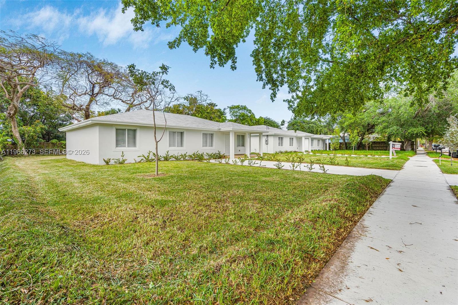 933 Northwest 50th Street Miami, FL 33127 - Photo 2 of 31 a view of a house with a yard