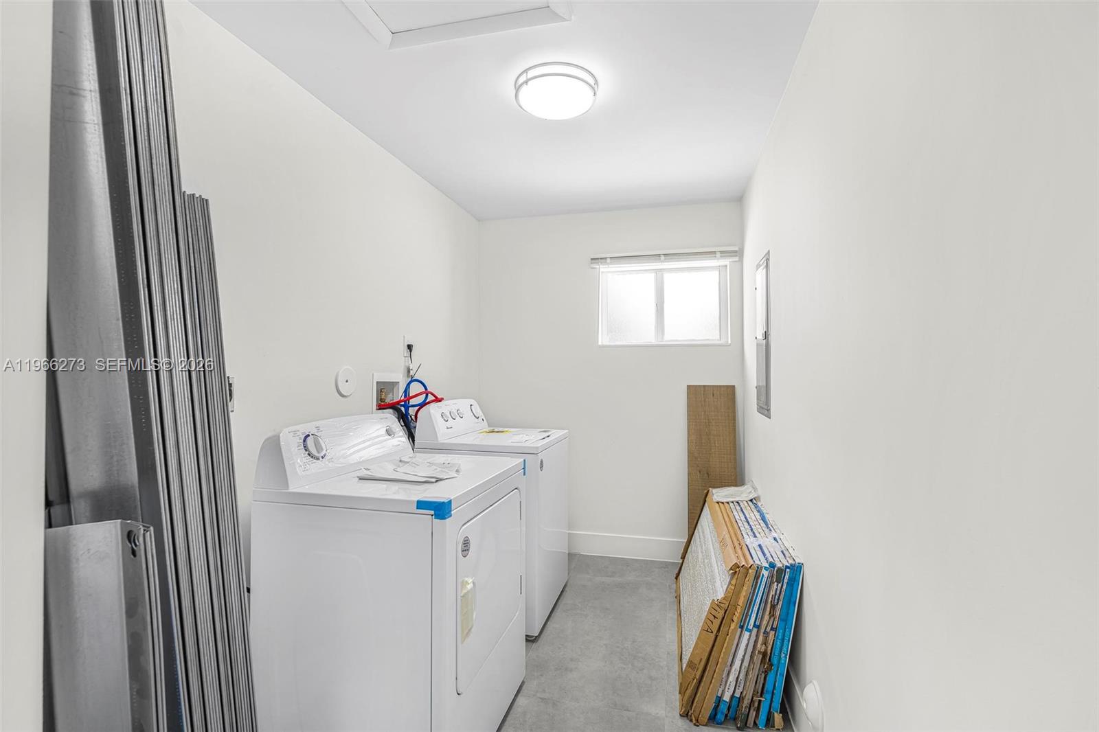 933 Northwest 50th Street Miami, FL 33127 - Photo 21 of 31 a bathroom with a sink and a mirror