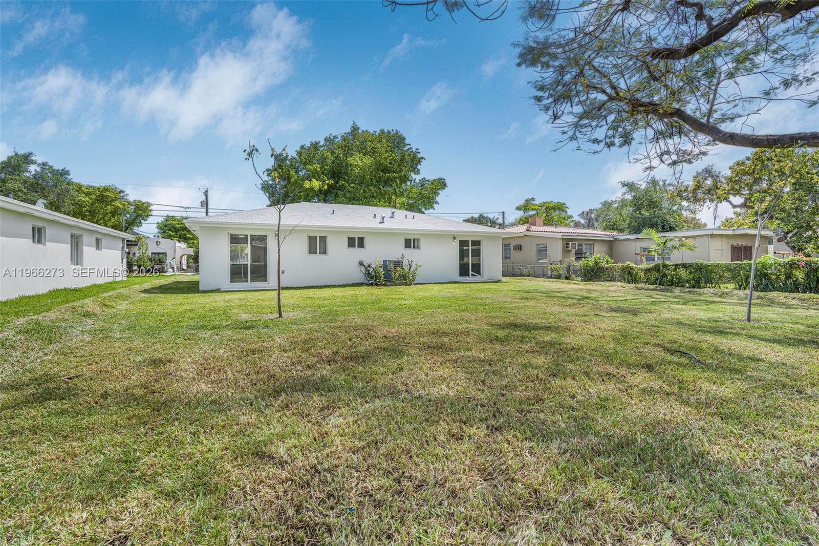 933 Northwest 50th Street Miami, FL 33127 - Photo 23 of 31 a view of a house with a big yard