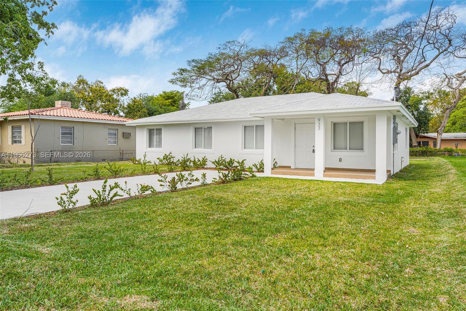 933 Northwest 50th Street Miami, FL 33127 - Photo 3 of 31 a view of a house with backyard and sitting area