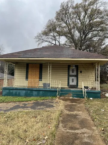 front view of a house with a garden