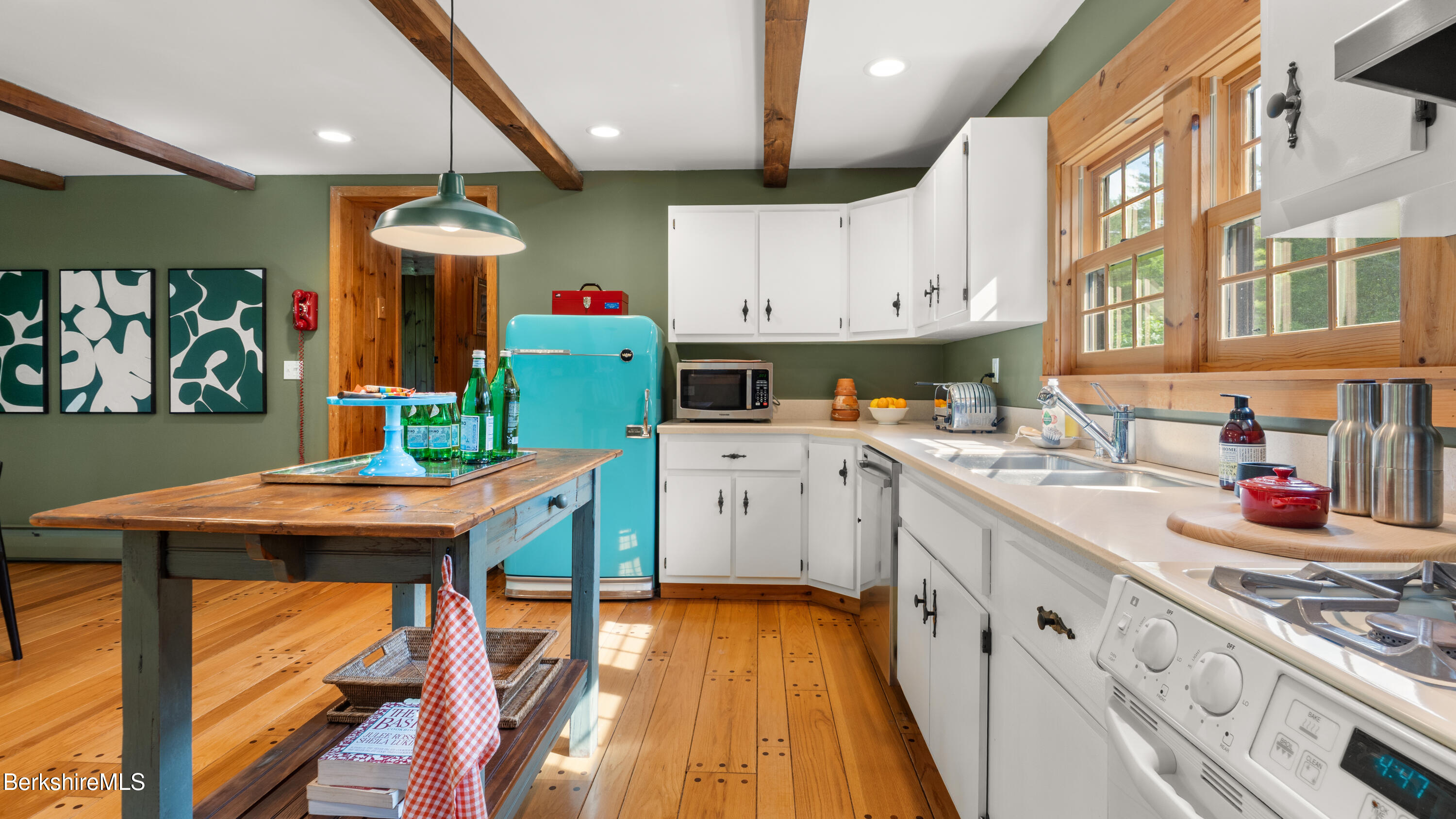 137 E Road Alford, MA 01266 - Photo 11 of 32 a kitchen with stainless steel appliances kitchen island granite countertop a table chairs in it and wooden floors