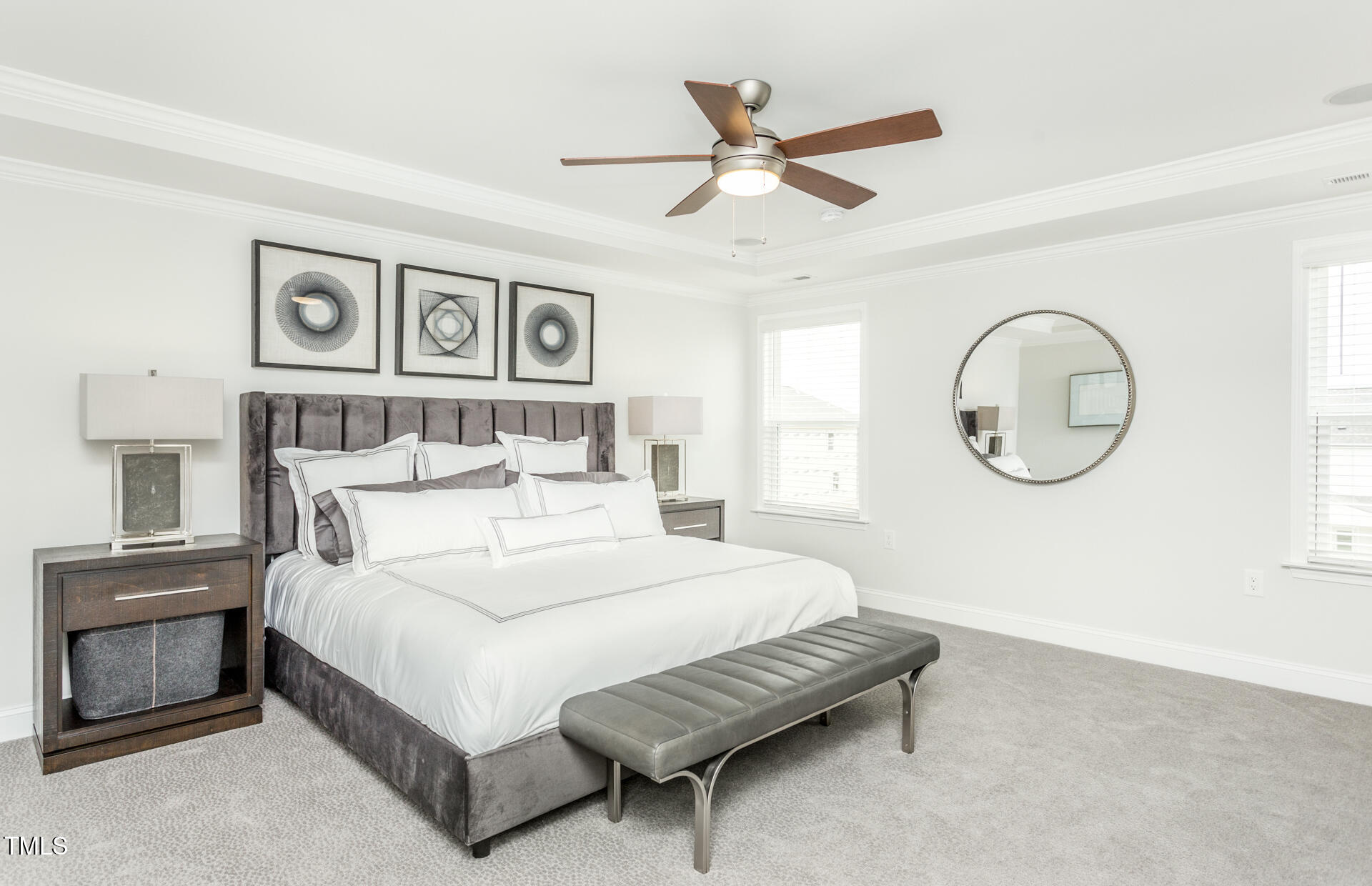 1111 Freestone Road Durham, NC 27703 - Photo 10 of 16 a bedroom with a large bed and a chandelier