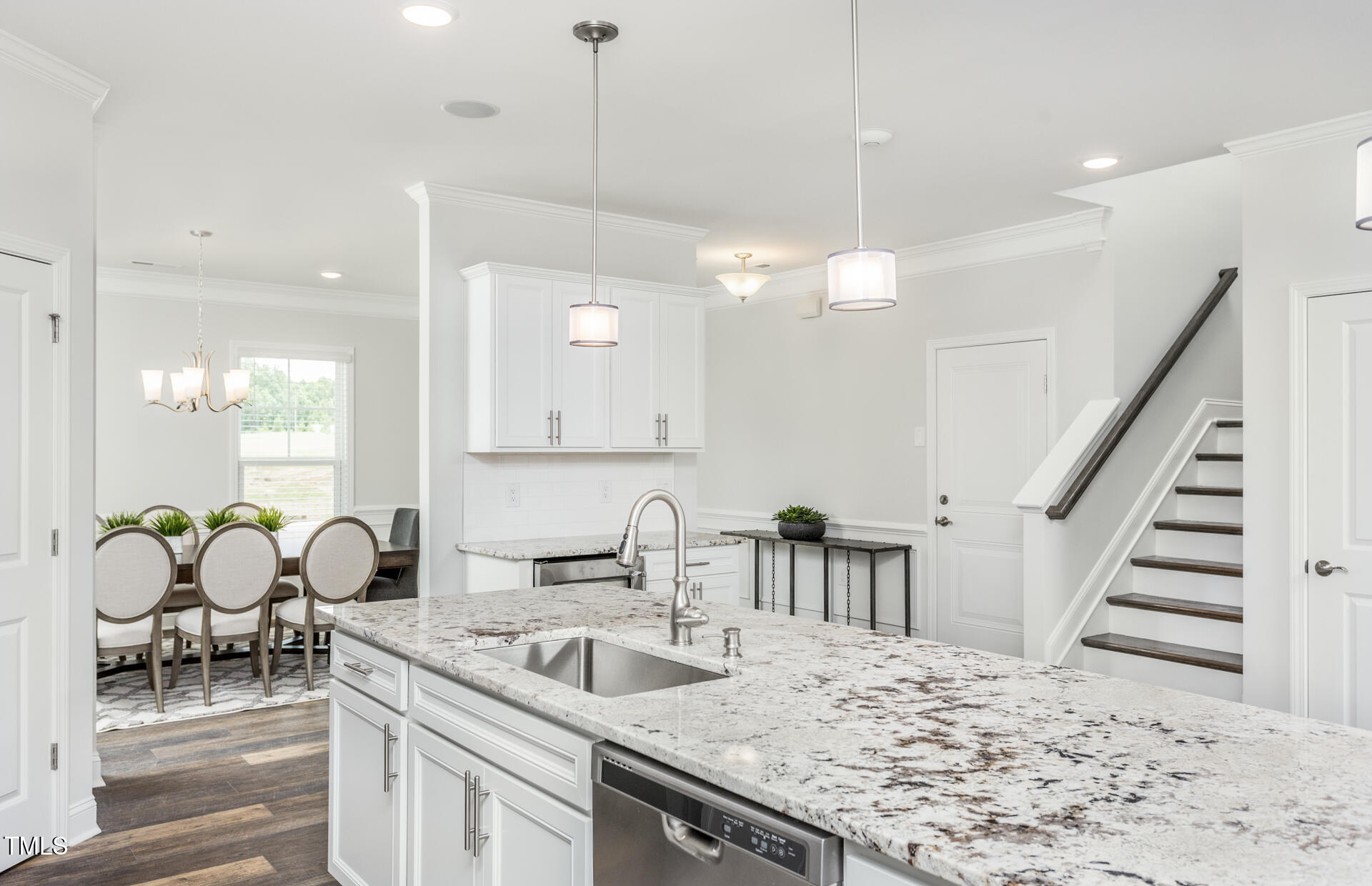 1111 Freestone Road Durham, NC 27703 - Photo 6 of 16 a kitchen with sink and center island