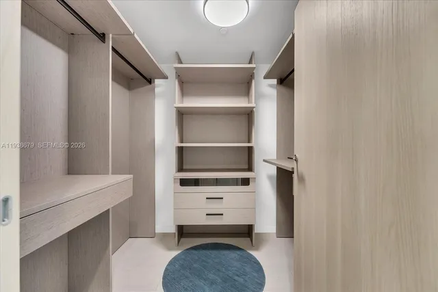 a bathroom with a walk in closet