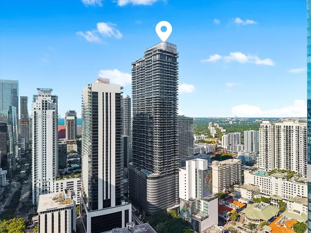 a view of a very nice looking dining room with a table and chairs