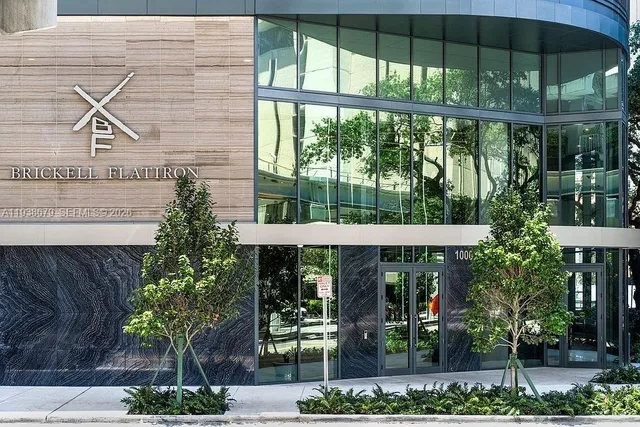 a bedroom with a bed and a mirror