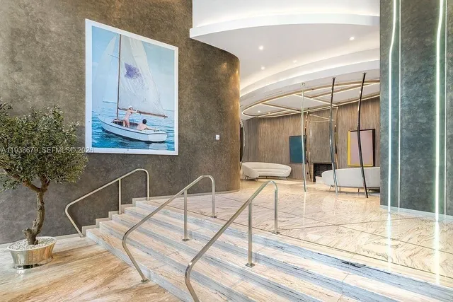 a bathroom with a tub shower and sink