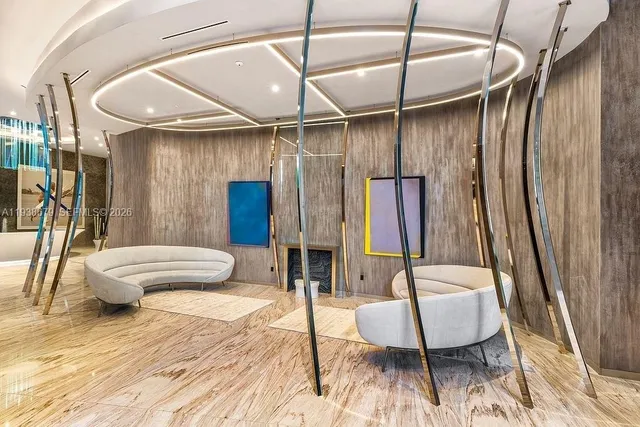 a view of a lobby with furniture and floor to ceiling window