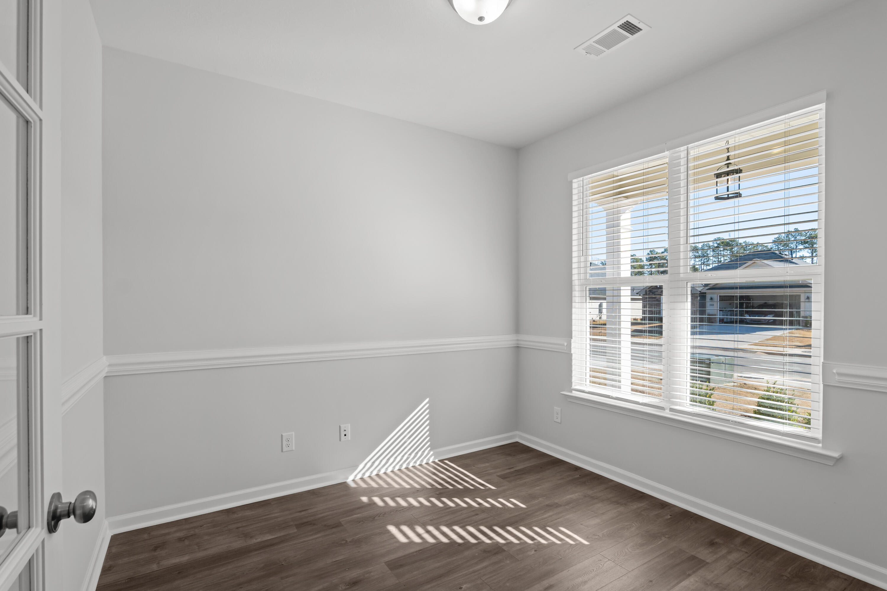 8163 Snelling Drive Aiken, SC 29803 - Photo 18 of 50 Flex room with chair rail and lots of natural lighting that would make a great office, craft room or just whatever you needed it to do.