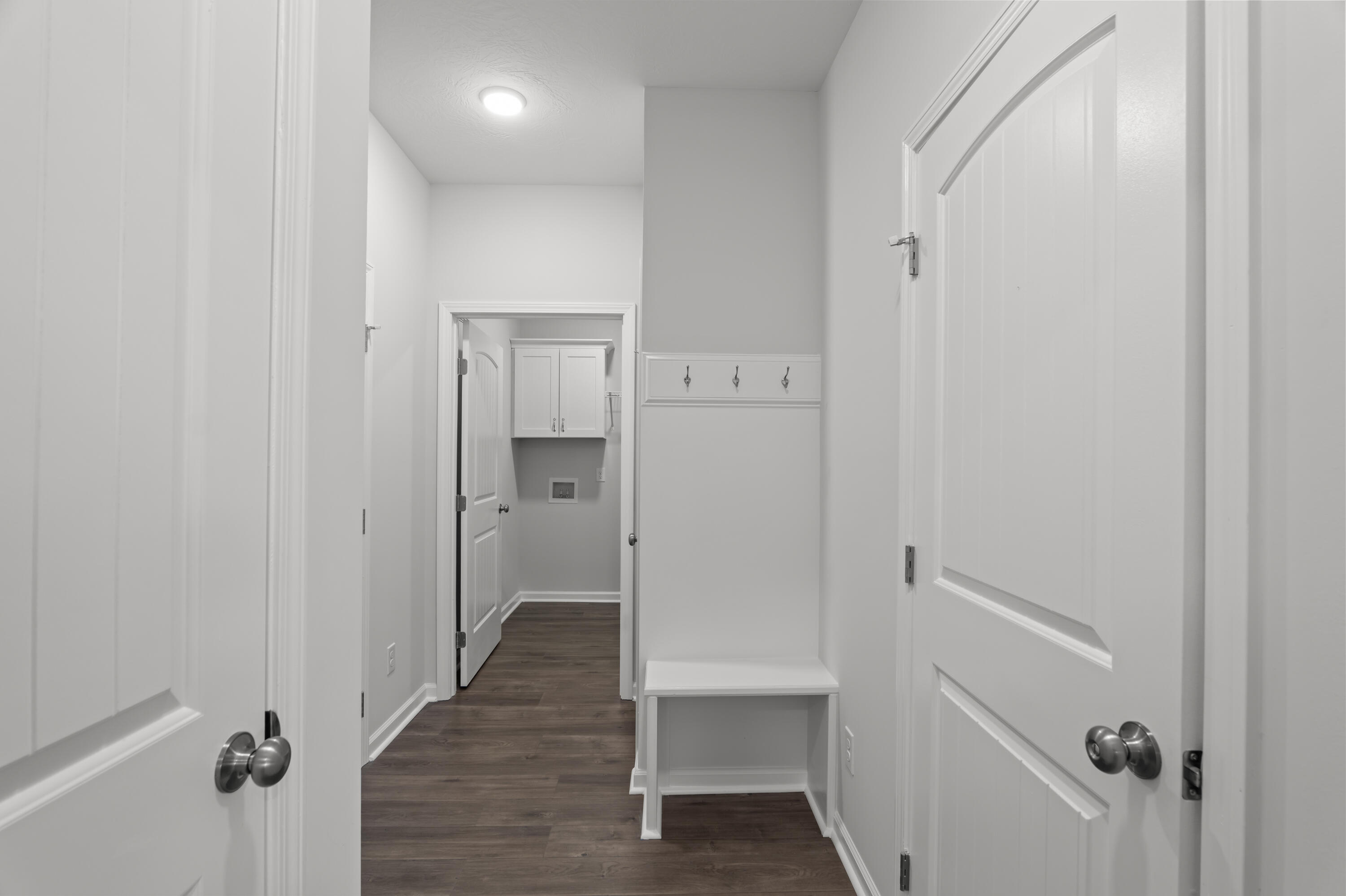 8163 Snelling Drive Aiken, SC 29803 - Photo 22 of 50 View of hallway from kitchen to garage, 1/2 bath, laundry, mudroom and storage.