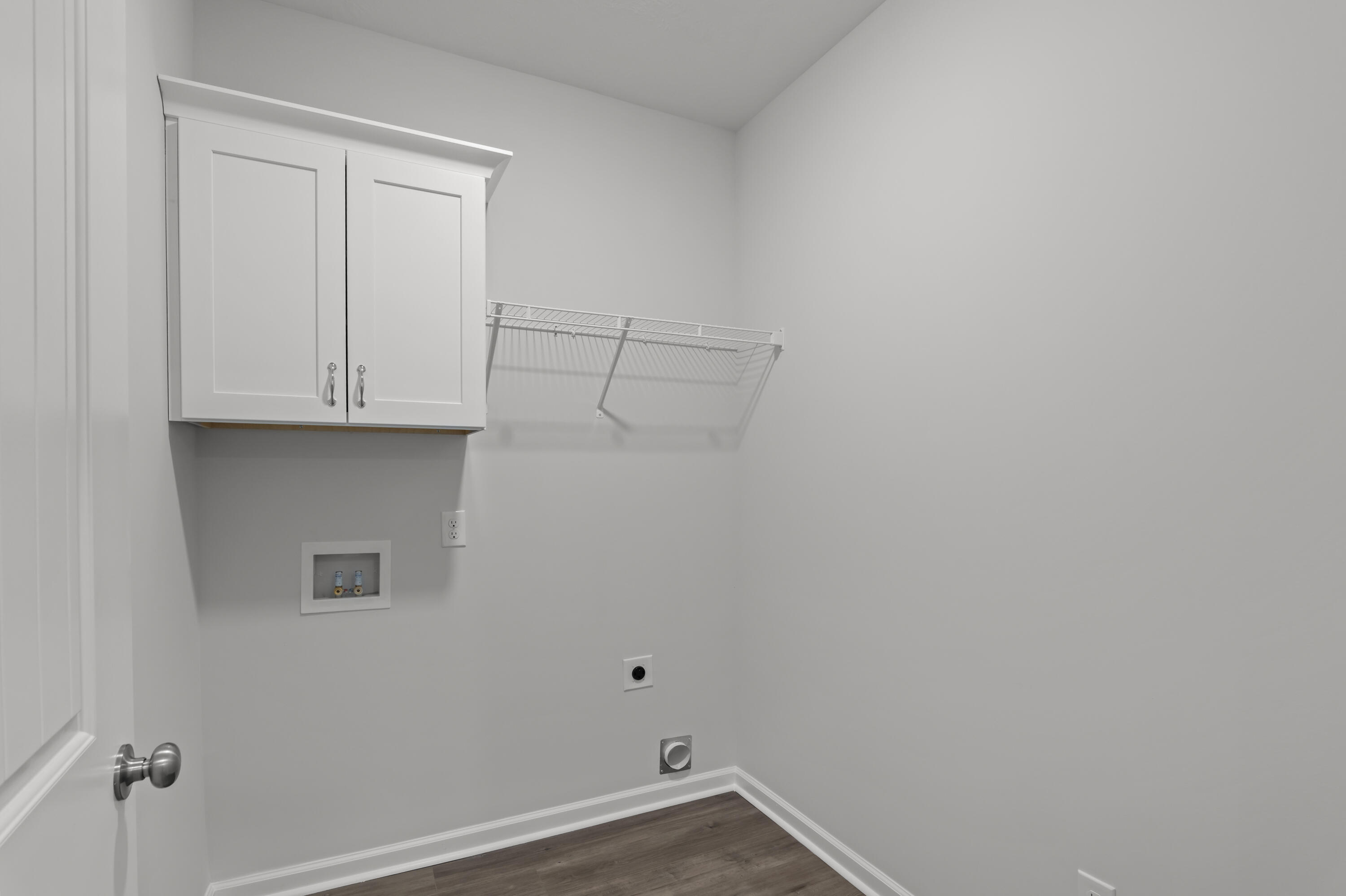 8163 Snelling Drive Aiken, SC 29803 - Photo 23 of 50 Laundry room on main floor with cabinetry.