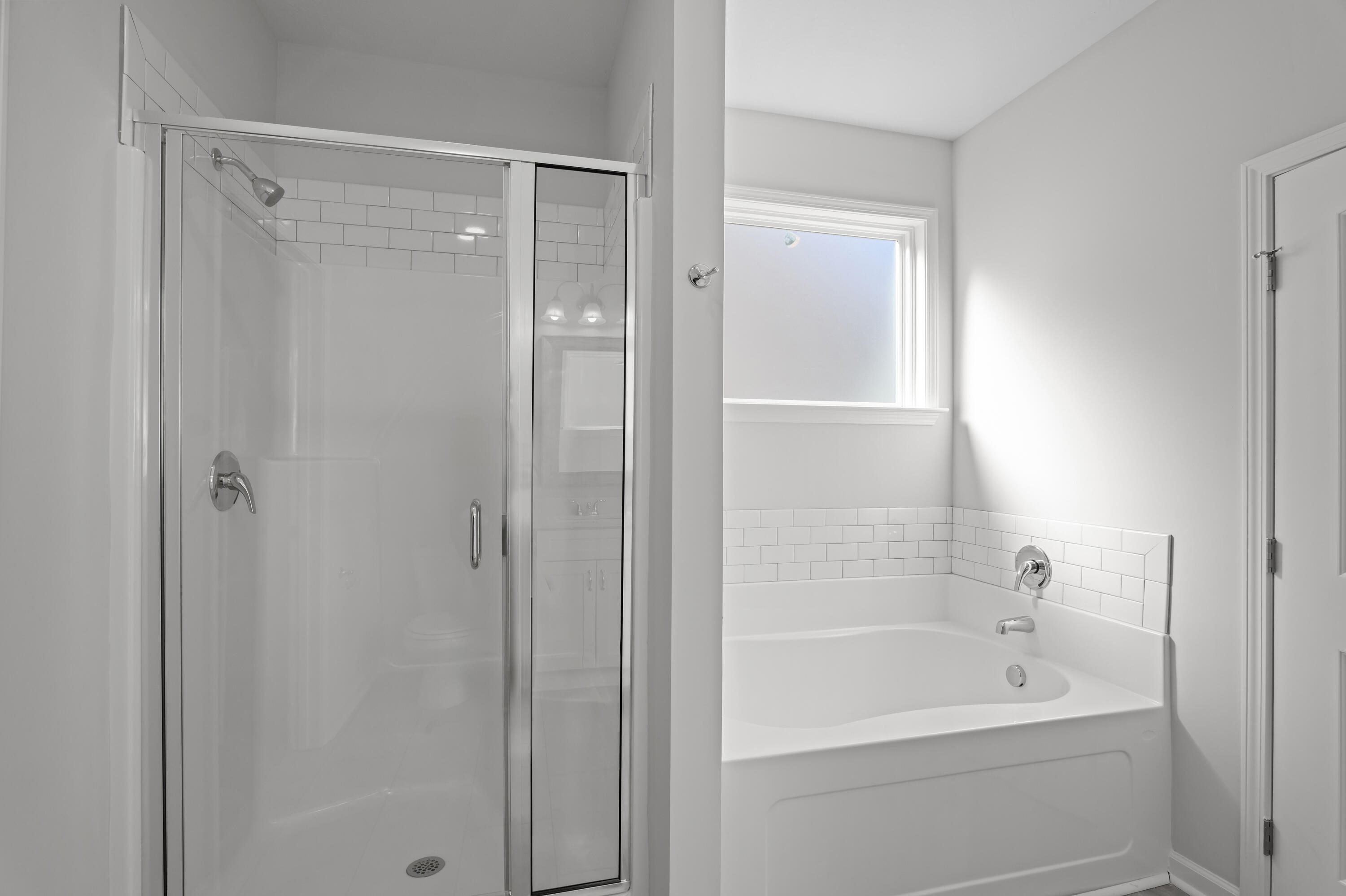 8163 Snelling Drive Aiken, SC 29803 - Photo 27 of 50 Separate walk in shower and soaking tub.