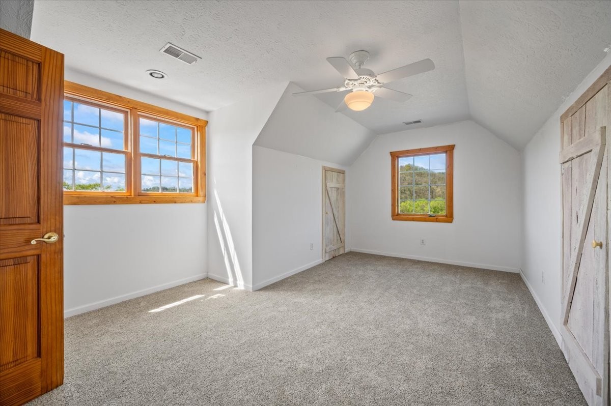 216 Old Wolf Hill Road Bethpage, TN 37022 - Photo 53 of 70 an empty room with windows and fan
