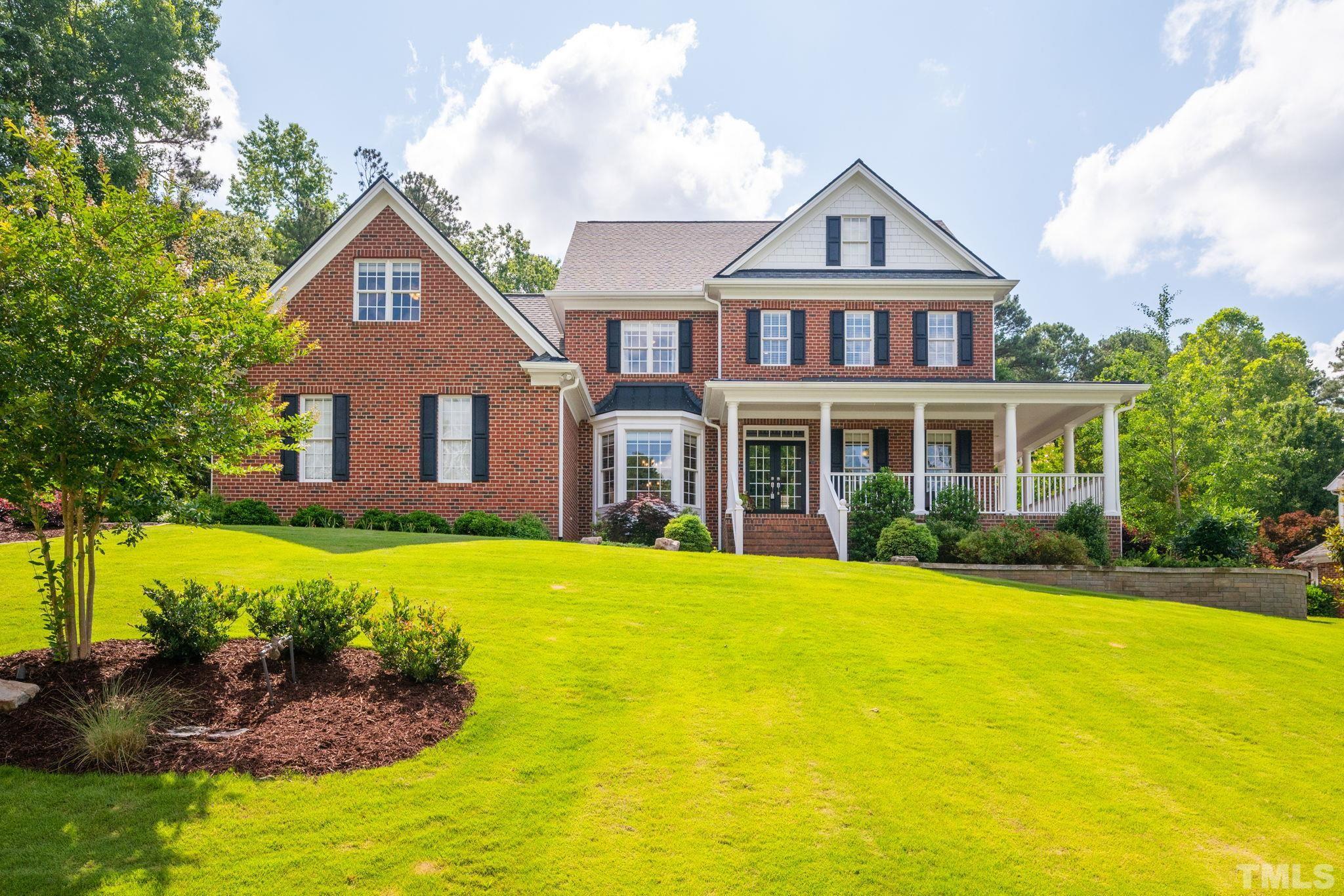 3817 Wesley Ridge Drive Apex, NC 27539 - Photo 1 of 75 a front view of a house with a yard