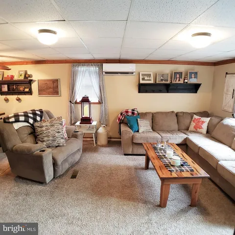 a living room with furniture and a rug