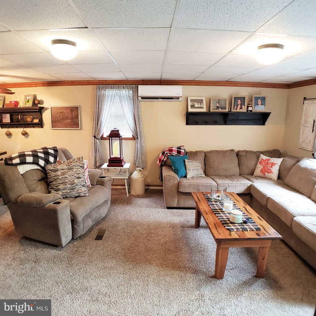 142 Hillcrest Street Winburne, PA 16879 - Photo 11 of 26 a living room with furniture and a rug