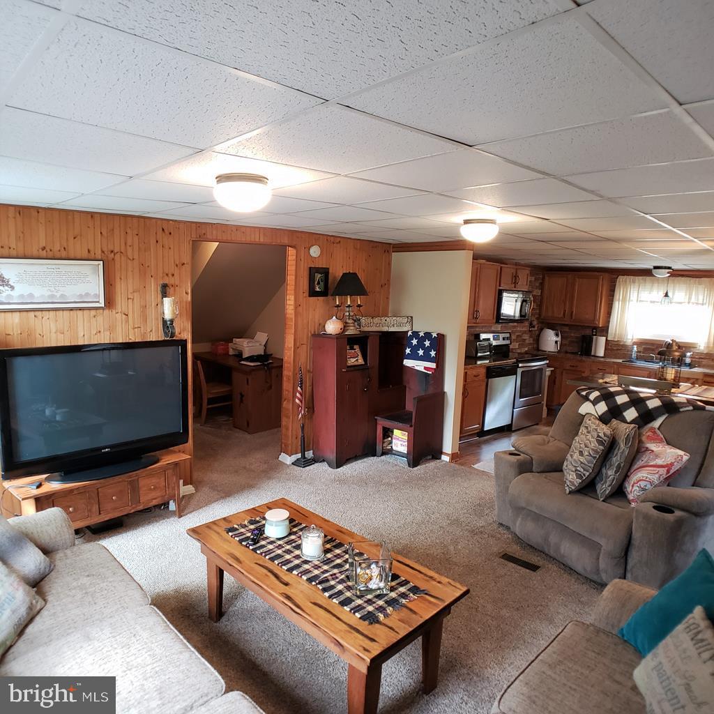 142 Hillcrest Street Winburne, PA 16879 - Photo 12 of 26 a living room with furniture and a flat screen tv